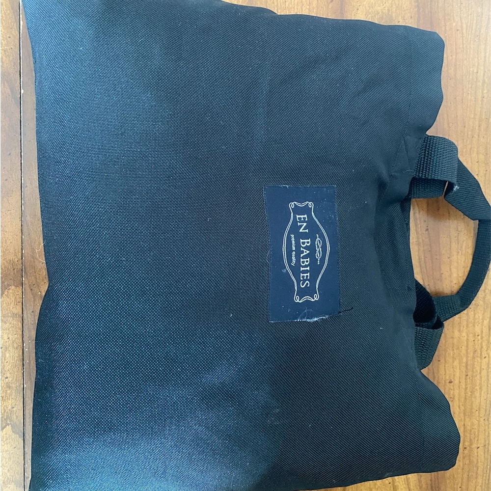 En babies cart cover with pockets and built in case